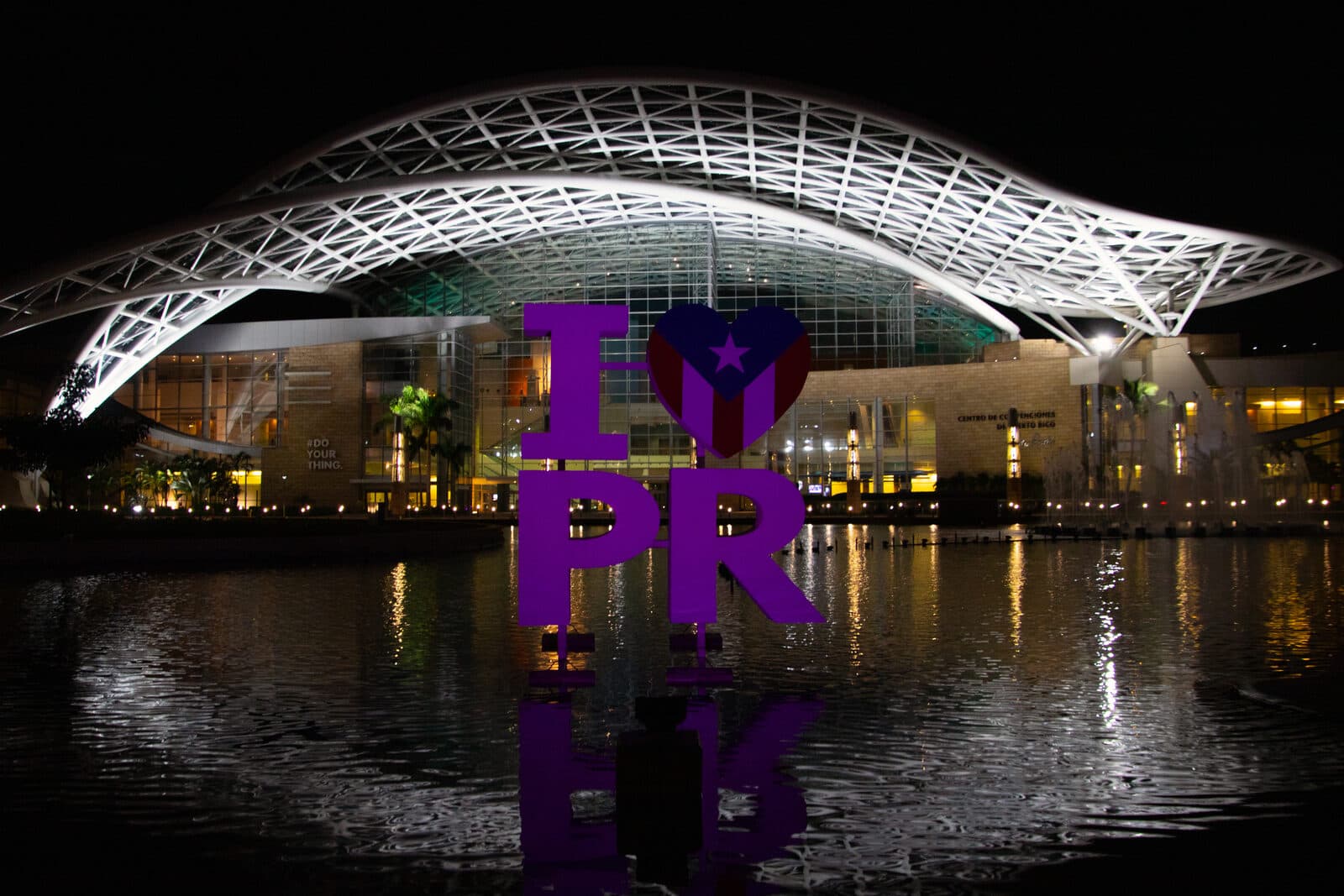 The Puerto Rico Convention Center at night — the district the event and its partner hotels sit in